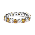 14K white gold eternity ring with alternating white and yellow diamonds