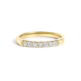 14K gold ring with 7 round diamond stones in a row across the band thumbnail 1
