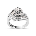 14K white gold ring with round and baguette diamond stones in swirl design