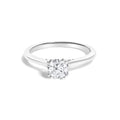 14K white gold solitaire ring with round diamond on cathedral shoulders