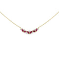 14K yellow gold necklace with three ruby and diamond stones on a bar