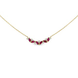 14K yellow gold necklace with three ruby and diamond stones on a bar thumbnail 1