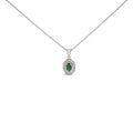 14K white gold necklace with oval emerald and diamond halo pendant