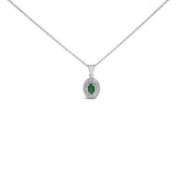 14K white gold necklace with oval emerald and diamond halo pendant thumbnail 1