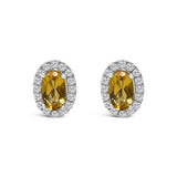 10K white gold stud earrings with oval diamond and halo accent stones thumbnail 1