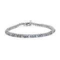 14K white gold bracelet with white and treated blue diamond stones