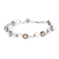 10K white gold bracelet with champagne and white diamond floral clusters