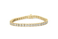 10K yellow gold tennis bracelet with round diamond stones channel set