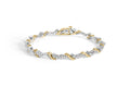 10K white and yellow gold bracelet with round diamond S-link stones