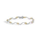 10K two-tone gold bracelet with X and wave links set with diamond stones thumbnail 1