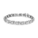 14K white gold bracelet with round diamond clusters on X-link design thumbnail 1