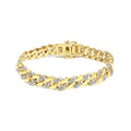 14K yellow gold Cuban bracelet with round diamond stones along the links