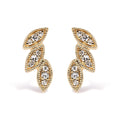 10K yellow gold ring with triple leaf diamond accent stones
