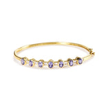 14K yellow gold bangle bracelet with oval tanzanite and round diamond stones thumbnail 1