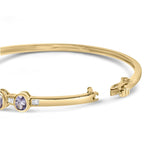 14K Yellow Gold Alternating Bezel Set 5MM Oval Shaped Tanzanite and 1/5 Cttw Diamond Bangle Bracelet (H-I Color, VS2-SI1 Clarity) - Fit's wrists up to 7.25