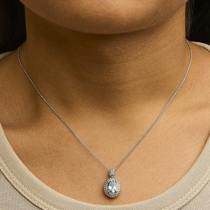 .925 Sterling Silver Oval Blue Topaz and Diamond Accent with Beaded Halo Pendant Necklace - 18