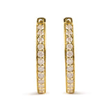 10K yellow gold hoop earrings with round diamond stones set in a continuous line thumbnail 1