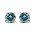 14K gold stud earrings with 2 round aqua blue diamond stones
