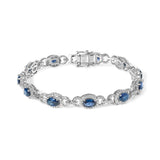 14K white gold bracelet with oval blue sapphire and diamond stones thumbnail 1