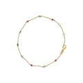14K yellow gold bracelet with alternating bezel-set ruby and diamond stations