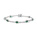 10K white gold bracelet with oval green emerald and diamond alternating stones