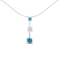 14K white gold pendant necklace with white and treated blue diamond stones