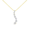 14K yellow gold necklace with baguette and round diamond journey pendant
