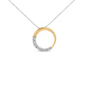 14K gold necklace with round diamond stones in a graduating open circle pendant
