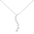 14K white gold necklace with round and baguette diamond stones in S shape
