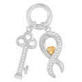 Two tone sterling silver key pendant necklace with diamond accent stones