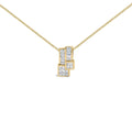 14K yellow gold necklace with princess and baguette cut diamond stones