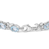 .925 Sterling Silver 16.0 Cttw Oval Blue Topaz and Diamond Accent Tennis X Link Bracelet (I-J Color, I1-I2 Clarity) - Size 7