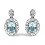 925 sterling silver drop stud earrings with oval blue topaz and diamond halo thumbnail 1