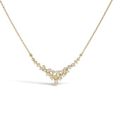 14K yellow gold necklace with scattered round diamond stones in a V thumbnail 1