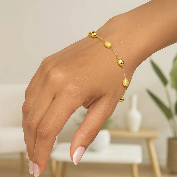 14k Yellow Gold Bracelet with Textured and Polished Pebble Stations