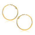 14K yellow gold flat hoop earrings with 1 1/4 inch diameter, polished finish