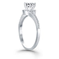 14K white gold ring with round diamond stones in a bypass swirl halo