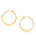 14K yellow gold diamond-cut hoop earrings, 25mm round faceted profile
