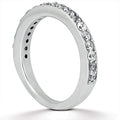 14K white gold ring with round pave diamond stones across the band