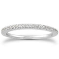 14K white gold ring with pave-set diamond stones on an engraved band