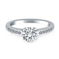 14K white gold engagement ring with channel-set diamond stones and cathedral setting