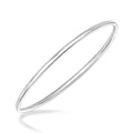 Rhodium-plated sterling silver slim polished slip-on bangle bracelet
