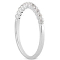 14K white gold ring with round floating diamonds in shared prong setting