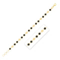 14K yellow gold bracelet with alternating black onyx stones and gold links