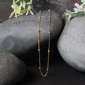 Two tone gold bead link chain with diamond cut faceted beads