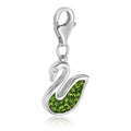 Sterling silver swan charm with green tone crystals set across the wings