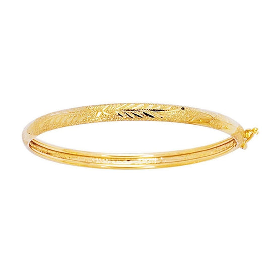 14K yellow gold children's dome bangle with diamond-cut motif detailing