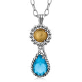 18K yellow gold and silver pendant with teardrop blue topaz stone