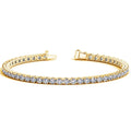 14K yellow gold tennis bracelet with round diamond stones