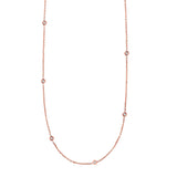 14K rose gold diamonds by the yard necklace with spaced round diamond stations thumbnail 1